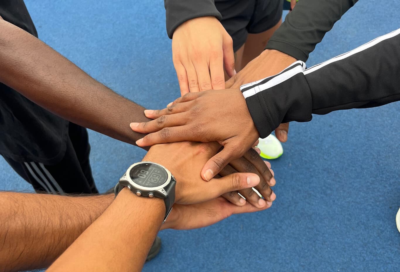 Runner lacing up shoes